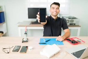 Black smartphone with a sleek, rectangular design and rounded corners.