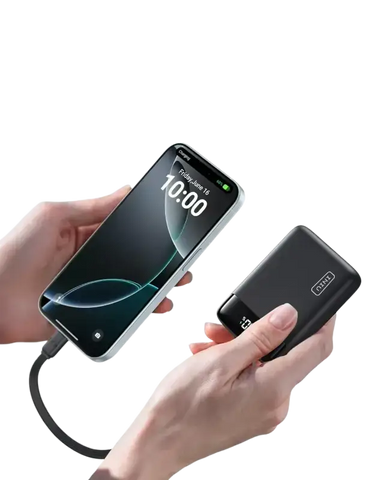 INIU 20000mAh portable charger held in hand with digital display showing battery level