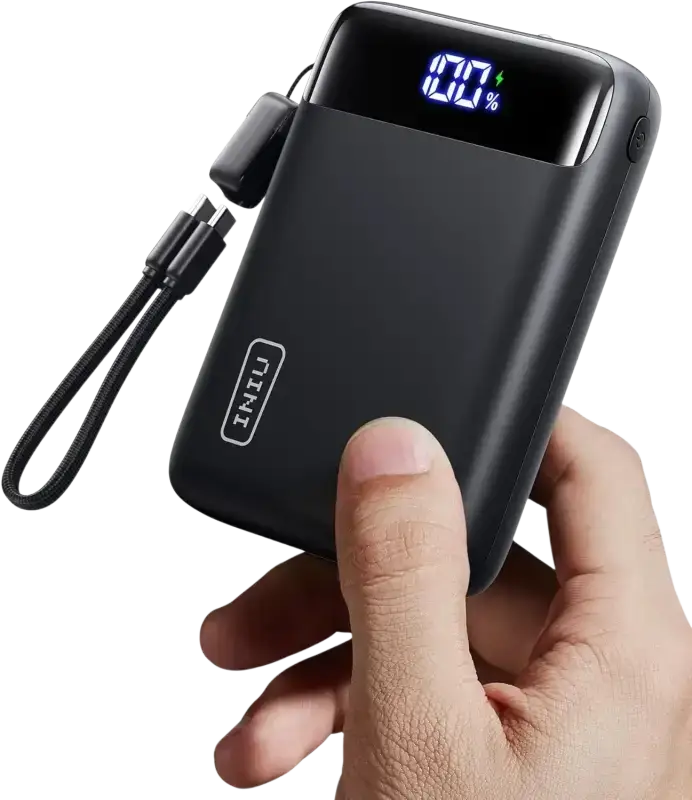 INIU 20000mAh portable charger held in hand with digital display showing battery level