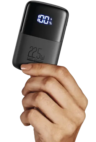 INIU 22.5W portable power bank with digital display showing battery percentage in hand