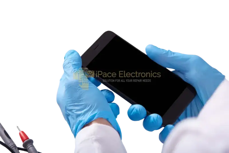 Technician holding a Samsung Galaxy A screen replacement in a repair workshop with tools
