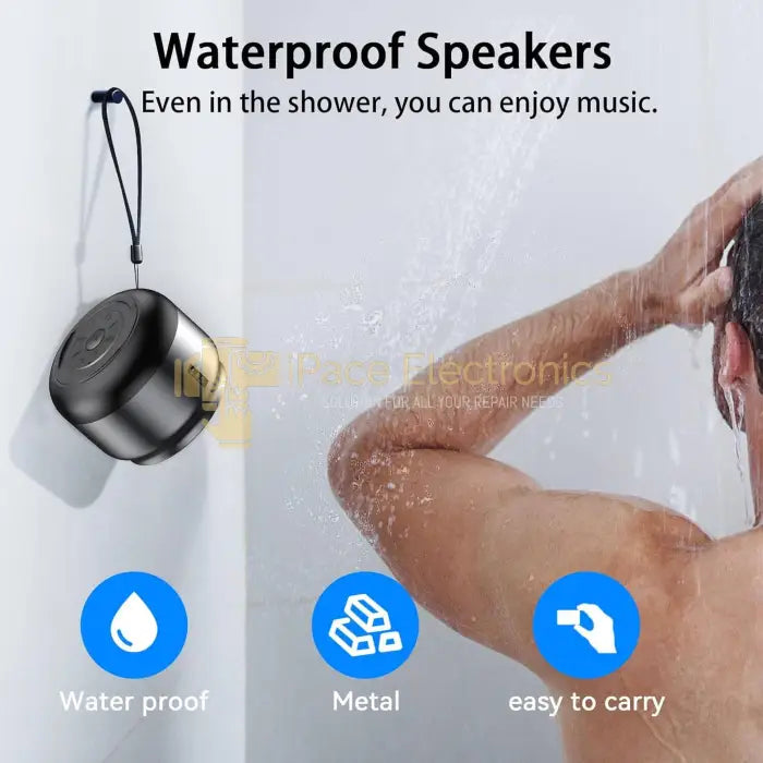 Waterproof portable Bluetooth speaker hanging in shower with man in background, highlighting speaker's water resistance and compact design.