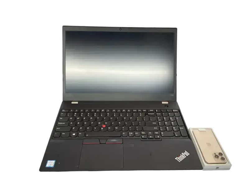 Preowned Lenovo ThinkPad T590 with sleek design and responsive keyboard next to a smartphone