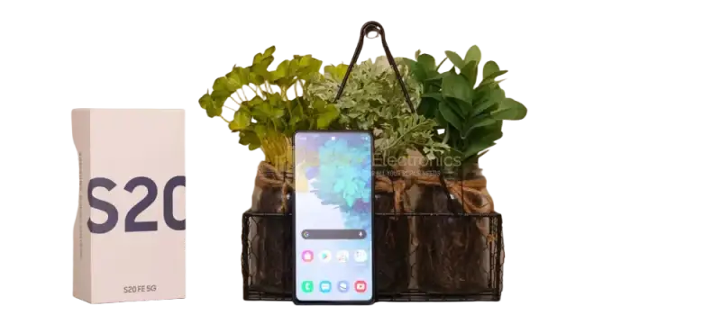 Samsung Galaxy S20FE 5G unlocked smartphone displayed with stylish plant decor and packaging